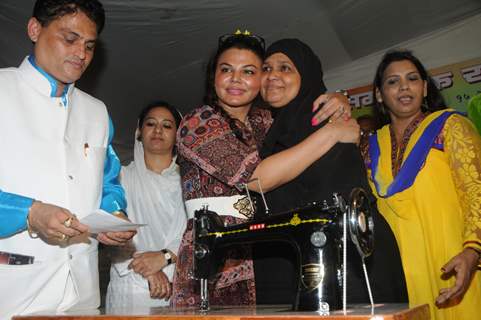 Rakhi Sawant hugs a guest at the event