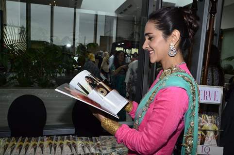 Tara Sharma snapped reading a magazine at The Dressing Room