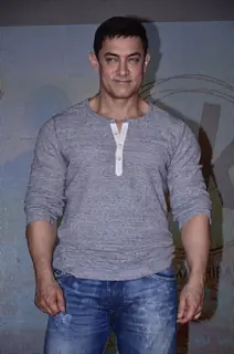 Aamir Khan poses for the media at the Second Poster Launch of P.K.