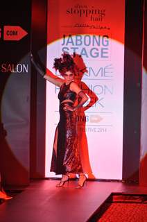 A model showcases a hair style by Little Shilpa at the Lakme Fashion Week Winter/ Festive 2014 Day 4