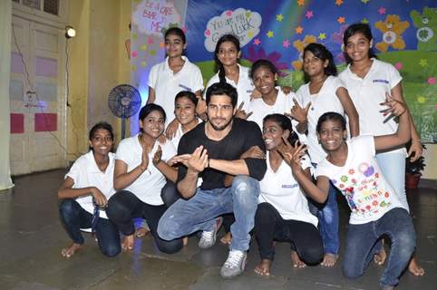 Sidharth Malhotra poses with Kids of Ashray NGO