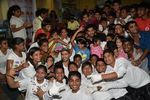 Varun Dhawan and Sidharth Malhotra pose with kids at Ashray Ngo