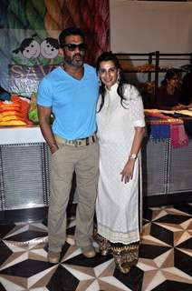 Suniel Shetty poses with Mana Shetty at Araish Charity Exhibition