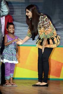 Sonam Kapoor greets a young fan at the Promotions of Khoobsurat in Delhi