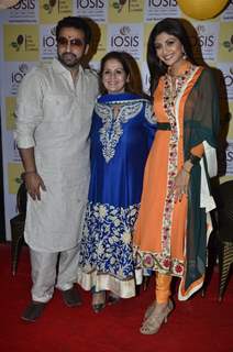 Shilpa Shetty and Raj Kundra pose with a guest at the Promotion of Iosis Medi Spa