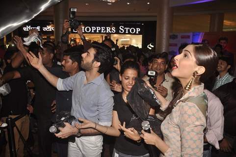 Fawad and Sonam give some goodies the fans at the Promotions of Khoobsurat at Viviana Mall, Thane