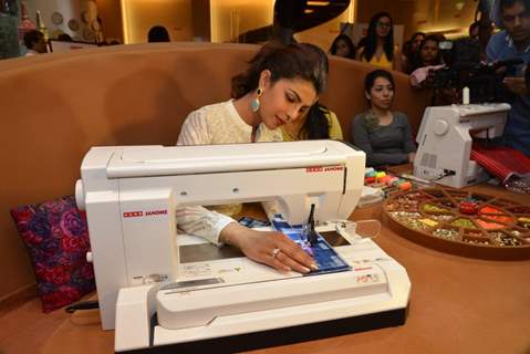 Priyanka Chopra tries her hand on sewing at the Promotions of Mary Kom at Usha World