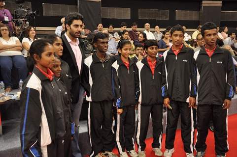 Abhishek Bachchan poses with participants at TT Championship