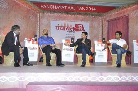 Madhur Bhandarkar interacting with the host at Aaj Tak Panchayat Talk Show