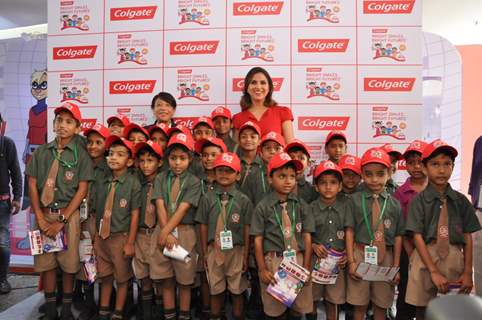 Lara Dutta poses with kids at the Colgate Bright Smiles Celebration