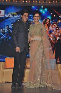 Shah Rukh Khan and Deepika Padukone pose for the media at the Music Launch of Happy New Year