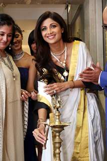 Shilpa Shetty lights the lamp at the inauguration of a Jewelry showroom in New Delhi