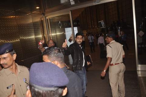 Abhishek Bachchan waves to the fans at Airport