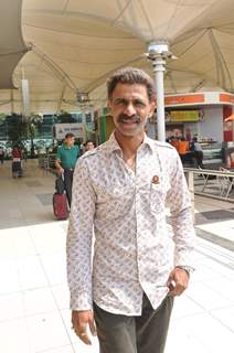 Makarand Deshpande poses for the media at Airport