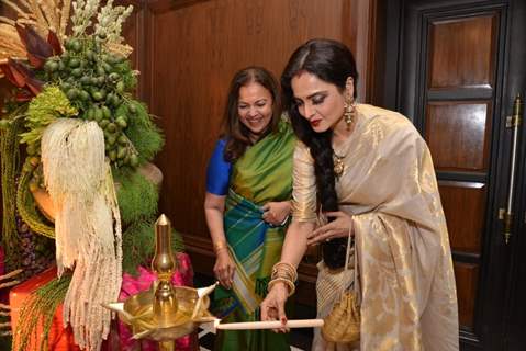 Rekha lighting the lamp at the Sahachari Foundations Show for Tarun Tahiliani