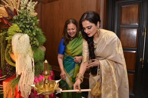 Rekha lighting the lamp at the Sahachari Foundations Show for Tarun Tahiliani