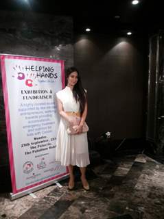 Kim Sharma poses for the media at the Helping Hands Exhibition