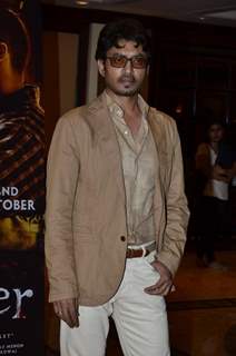 Irrfan Khan poses for the media at the Book Launch of Haider, Omkara and Maqbool