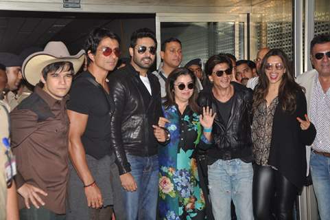 Cast of Happy New Year poses for the media at the Airport