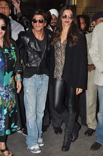 Deepika Padukone and Shah Rukh Khan pose for the media at Airport