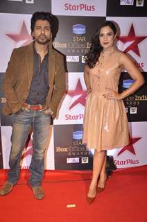 Nikhil Dwivedi and Richa Chadda pose for the media at Star Box Office Awards