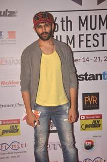 Kartik Tiwari poses for the media at the 16th MAMI Film Festival