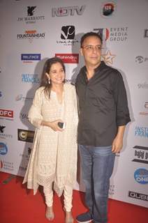 Vidhu Vinod Chopra poses with wife at the 16th MAMI Film Festival