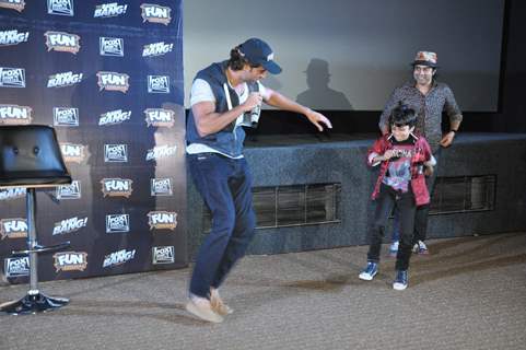 Hrithik Roshan shakes a leg with a young fan at the Special Screening of Bang Bang