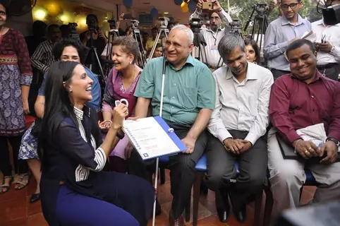 Neha Dhupia interacts with a guest at the Brailler Menu Launch