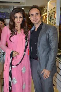 Raveena Tandon poses with a guest at the Minerali Store Launch
