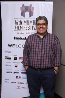 Rajeev Masand poses for the media at the 16th MAMI Film Festival Day 5