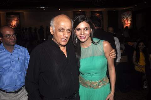 Mukesh Bhatt poses with a guest at the Launch of Rajneeti 2