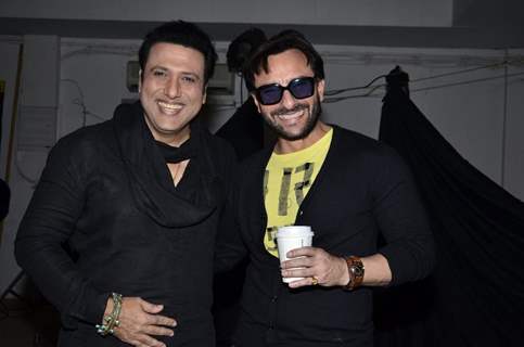 Govinda and Saif Ali Khan pose for the media at Happy Ending Media Interactions