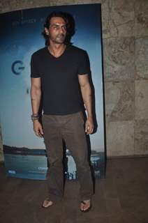 Arjun Rampal poses for the media at the Screening of Gone Girl