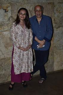 Mahesh Bhatt poses with wife at the Special Screening of Rang Rasiya