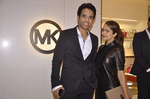 Amrita Arora poses with Tusshar Kapoor at Michael Korrs Store Launch