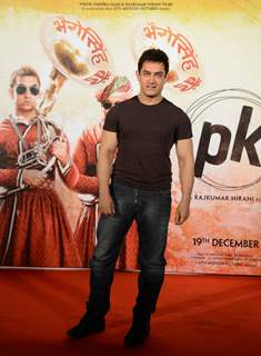 Aamir Khan poses for the media at the Song Launch of P.K.