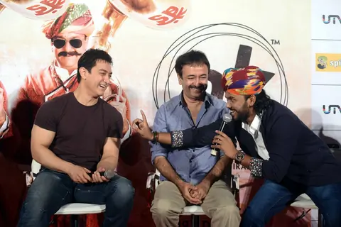 Aamir Khan interacts with the singer at the Song Launch of P.K.