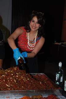 Amrita Raichand was snapped preparing cake at a Cake Mixing Event