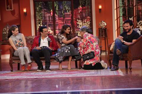 Dadi performs an act with Ileana D'Cruz at the Promotion of Happy Ending on Comedy Nights With Kapil