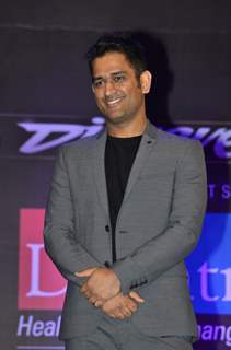 MS Dhoni poses for the media at Positive Health Awards