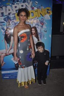 Ileana D'Cruz poses with a kid at the Special Screening of Happy Ending