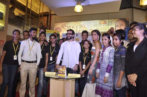 Saif Ali Khan and Ileana D'Cruz pose with the staff of Crossword at the Promotions of Happy Ending