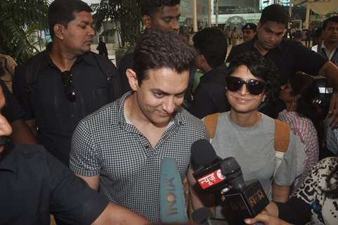 Aamir Khan was snapped giving media byte at airport while returning from Arpita Khan's Wedding
