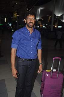 Kabir Khan poses for the media at airport while returning from Arpita Khan's Wedding