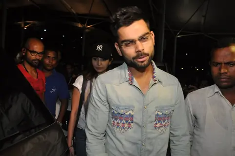 Virat Kohli makes a funky face for the camera at Airport