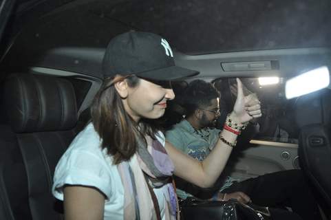 Anushka Sharma and Virat Kohli wave to their fans at Airport