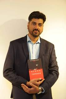 Sandeep Unnithan poses with his Book Black Tornado at the Launch