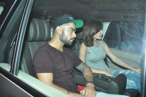 Anushka Sharma and Virat Kohli were snapped in their car at at Karan Johar 's Bash