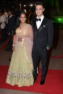 Arpita Khan and Aayush Sharma pose for the media at their Wedding Reception